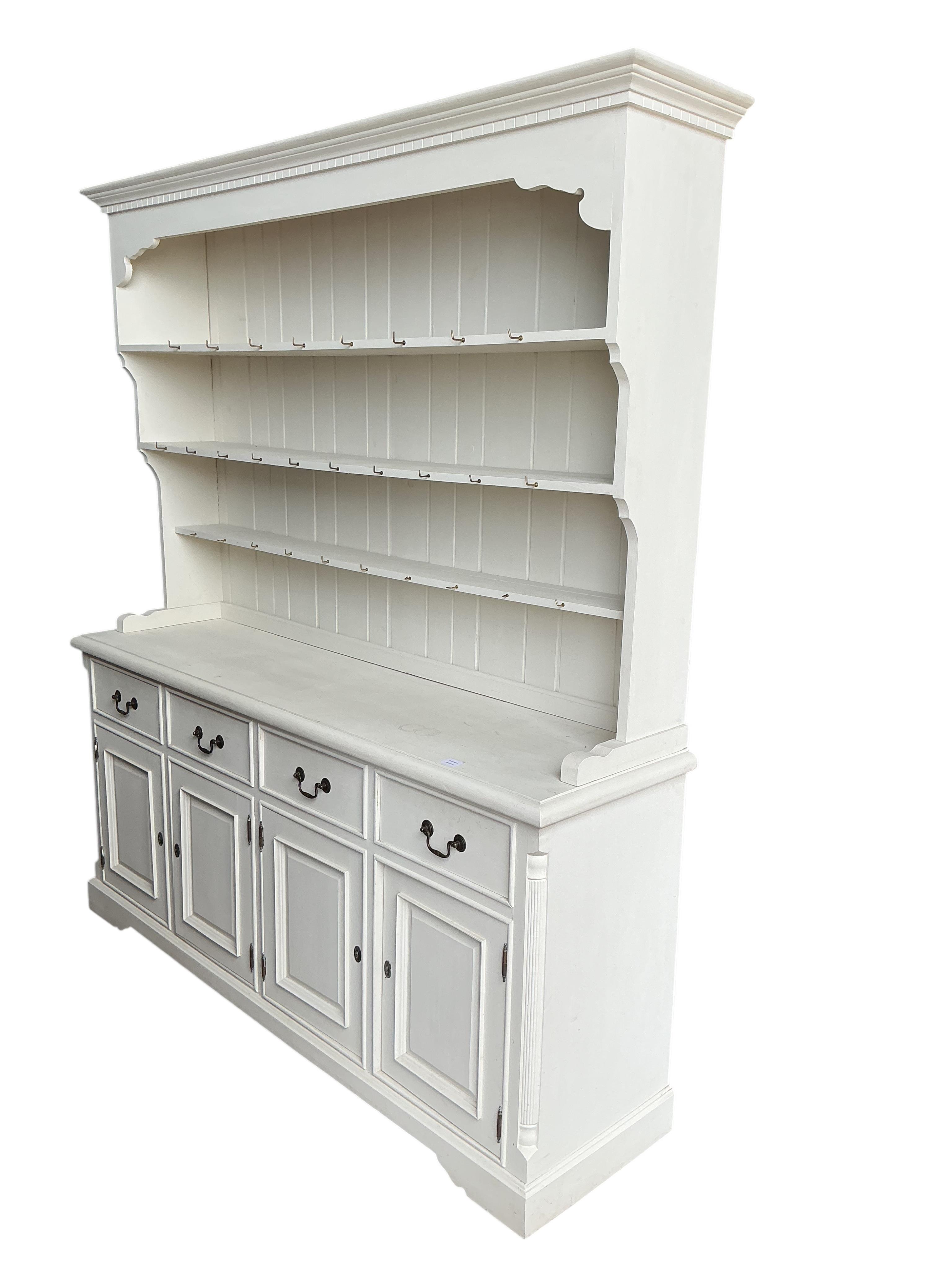 A Victorian style white painted dresser with boarded rack, width 180cm, depth 48cm, height 207cm